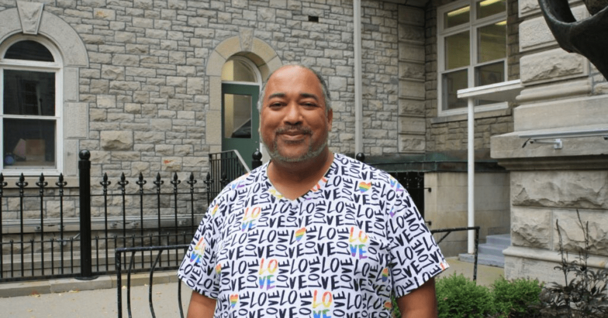 Velvet Wells smiles and stands outside the Arts Court on Oct. 23, 2024. They conducted the “Practicing Disrupting Racism” workshop at the Grove on Oct. 19 and Nov. 9 which uses improv to disrupt racism in people's day-to-day lives. [Photo by Ana Maria Cadena/ The Charlatan]
